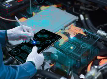 Auto mechanic using a tablet wireless scanning tool - Nexusmind supports the automotive industry. 